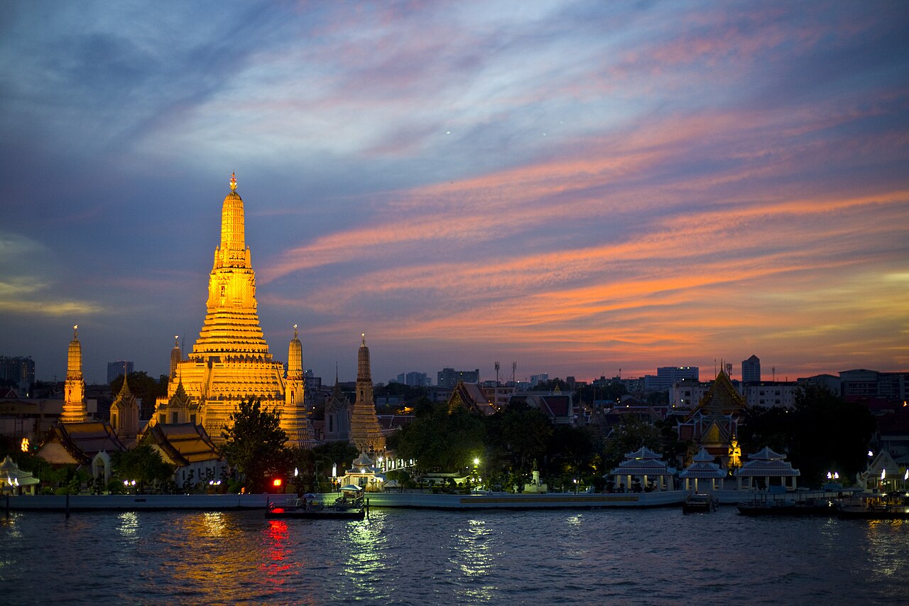 Wat Arun beside the river at sunset